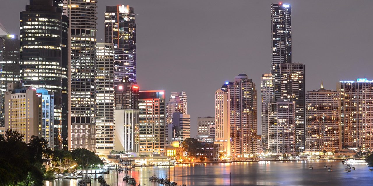 Image shows the bright city lights of Brisbane at night
